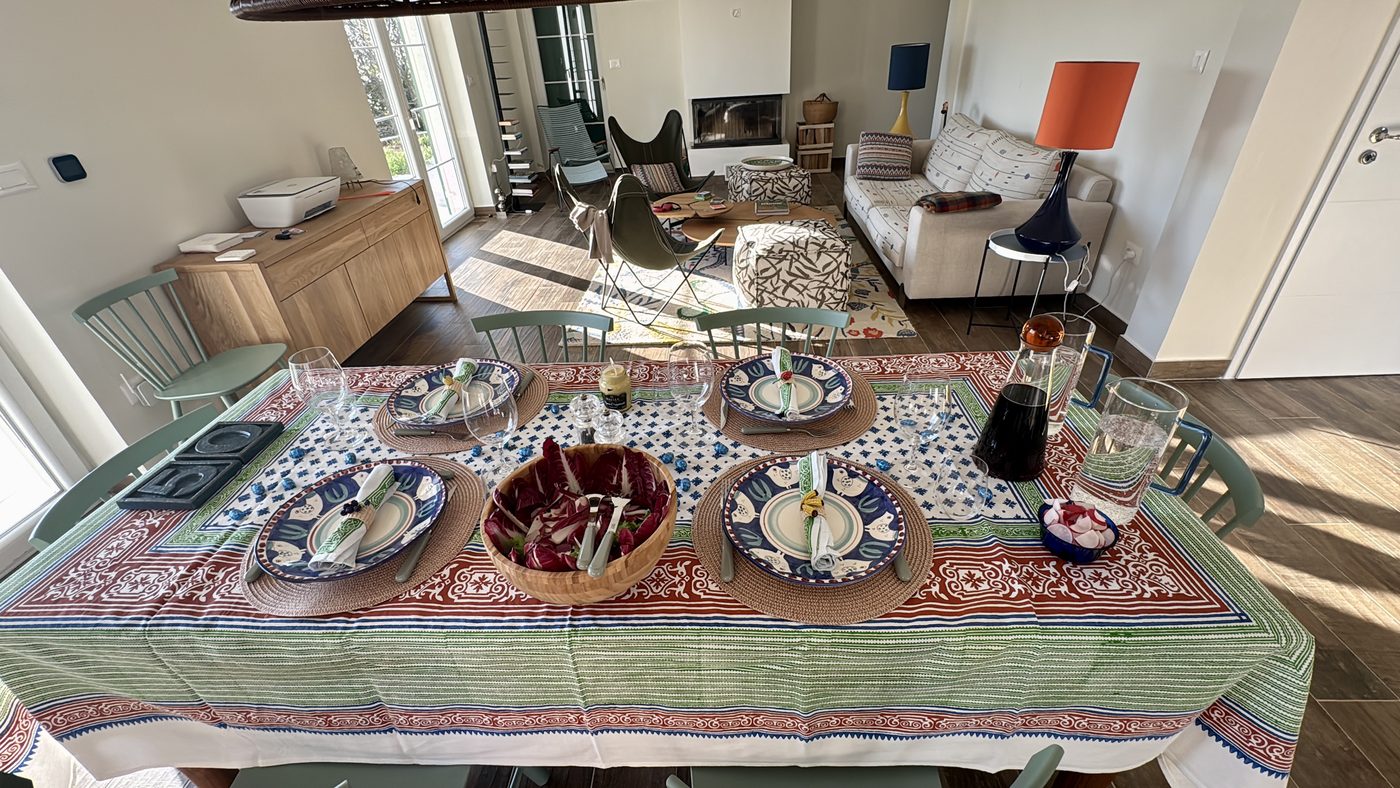 The dining table laid, with the living room beyond